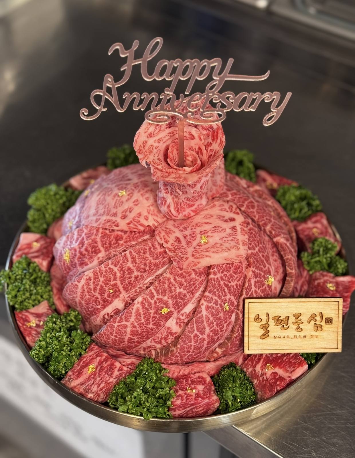 Grilled Hanwoo served medium-rare by staff