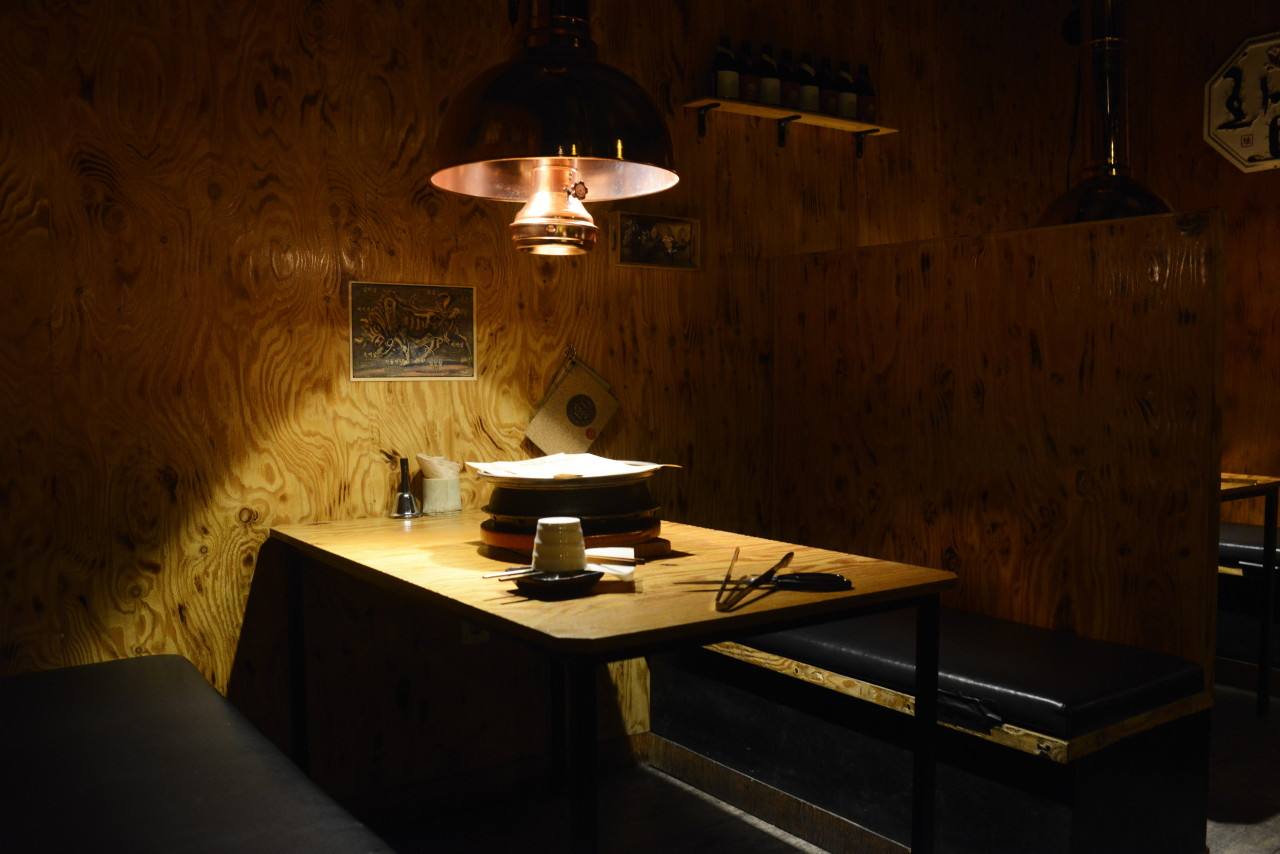 Atmospheric charcoal-grill dining room